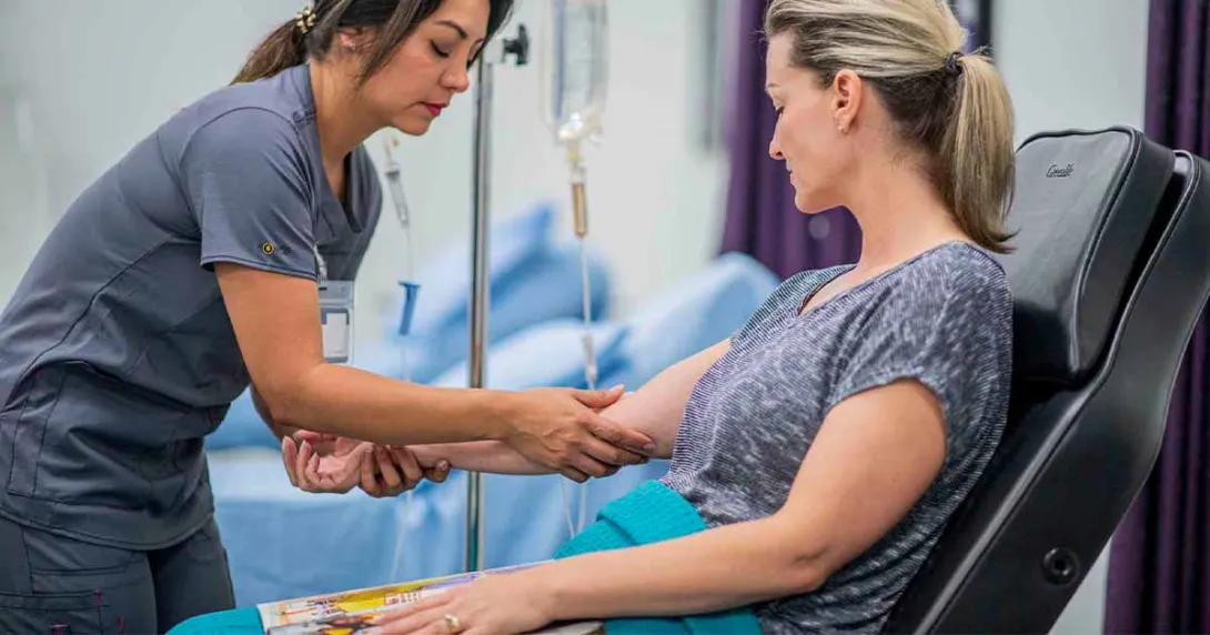 Nurse prepping a patient for IV insertion