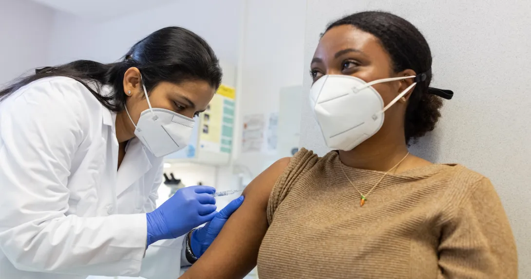A patient getting a vaccine shot