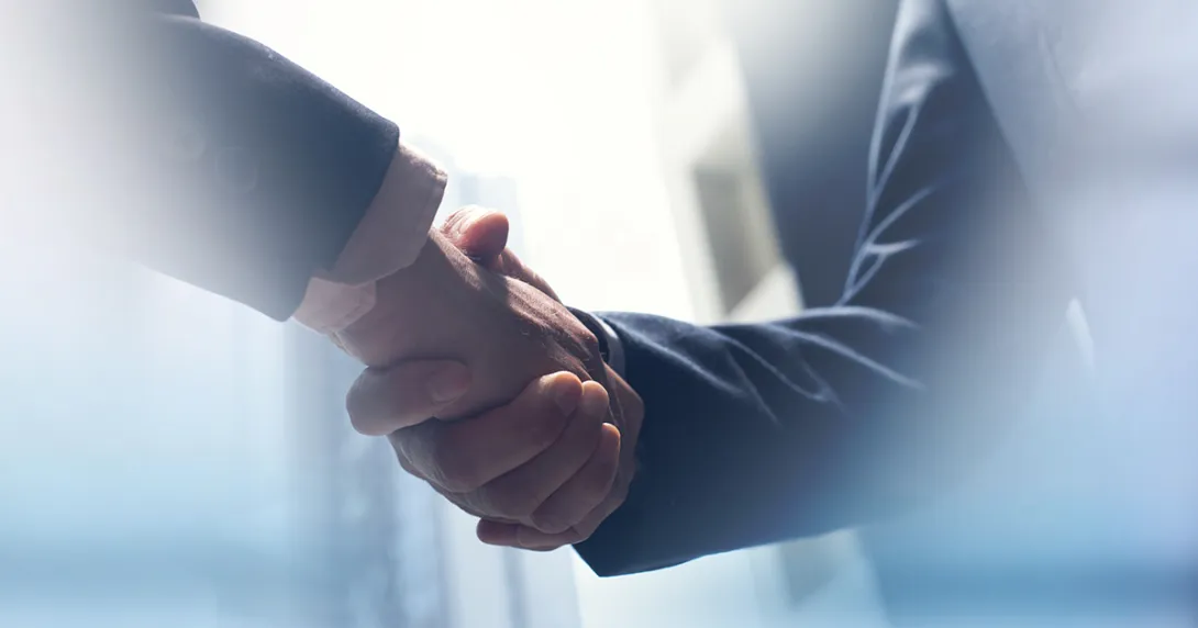 Handshake by people in suits