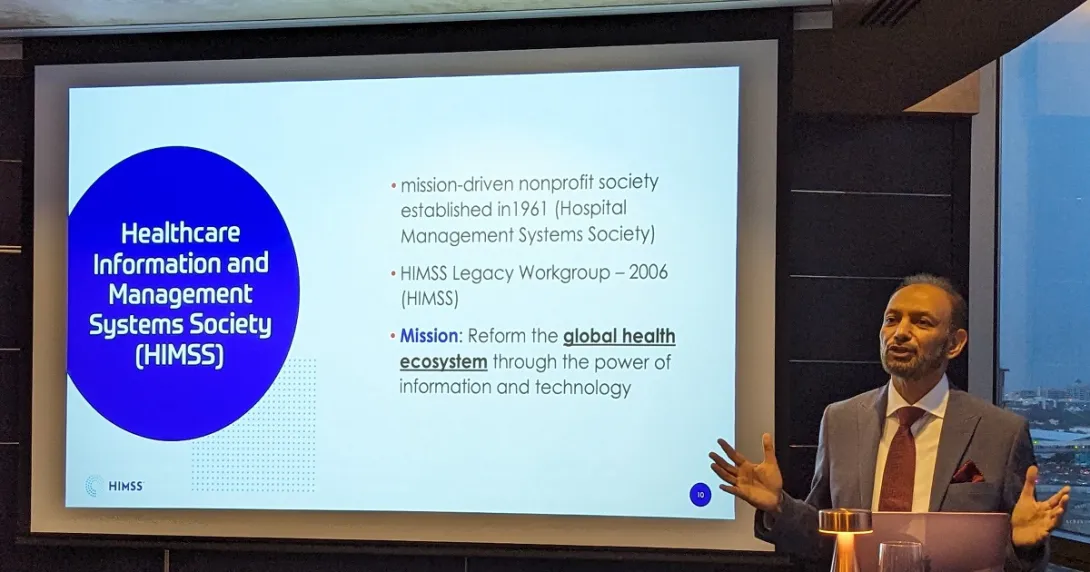 Professor Mahmood Adil speaking in front of the attendees