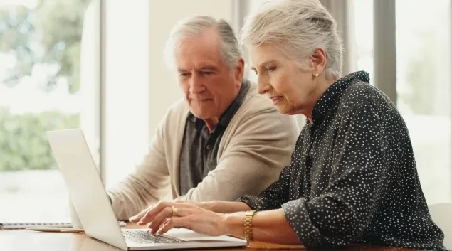 People using a laptop