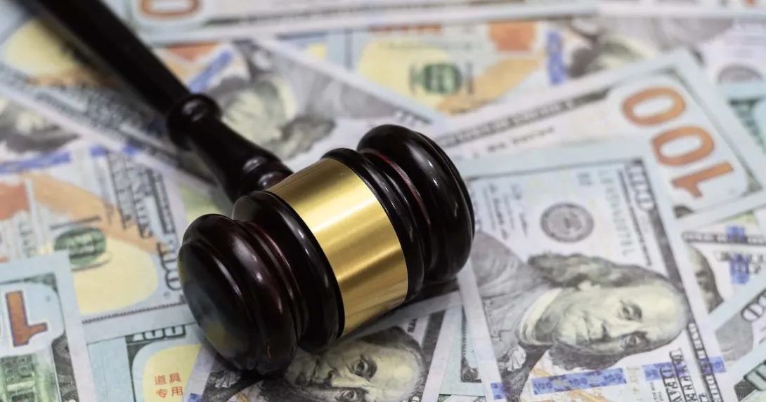 Gavel on pile of money