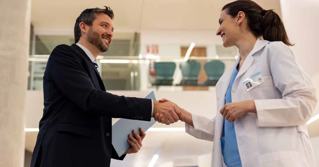 Doctor shaking hands with executive