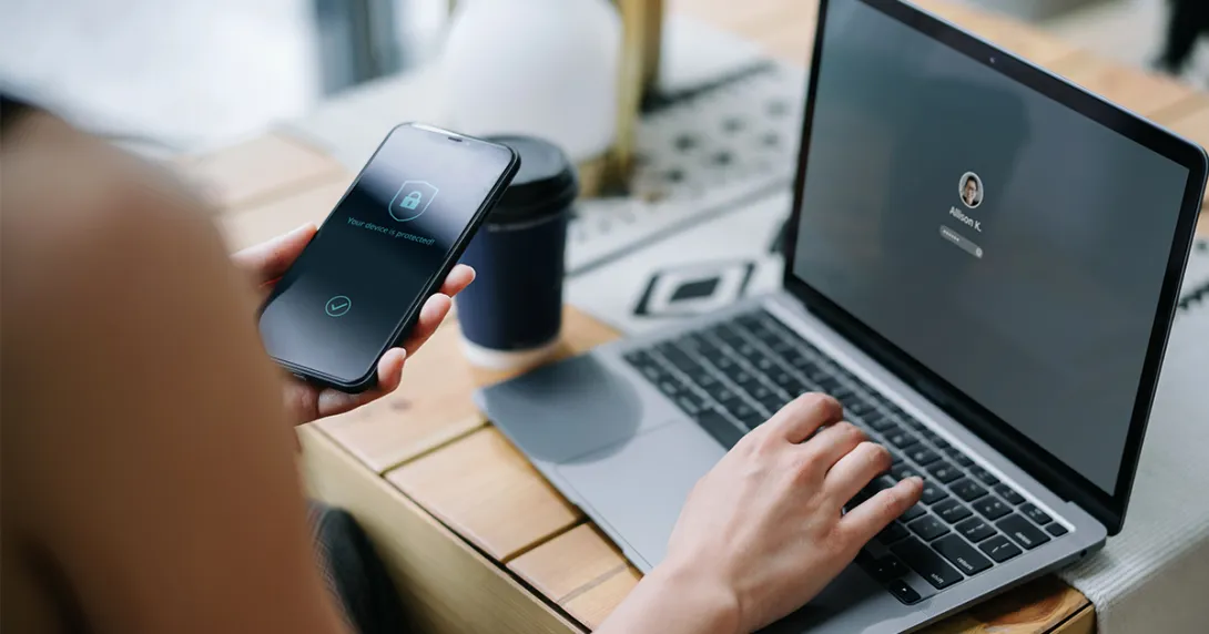 A patient uses a mobile phone to verify identity, which supports data privacy across industries, including telehealth.