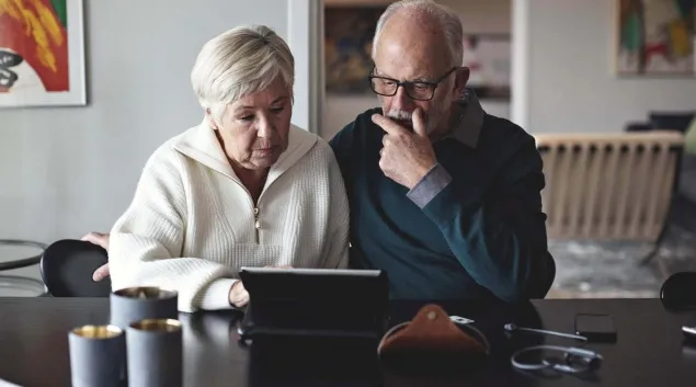 People using a laptop