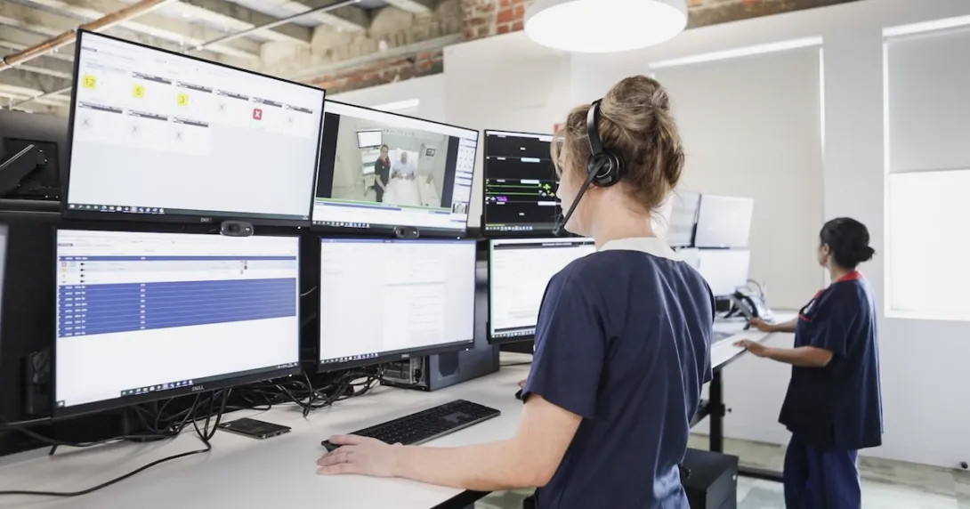 Healthcare professionals in front of monitors
