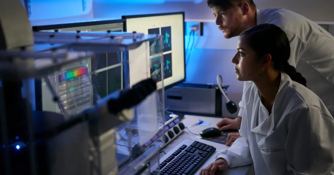 Clinicians examine data on screens