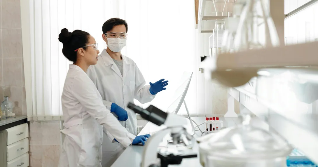 Medical researchers on a computer