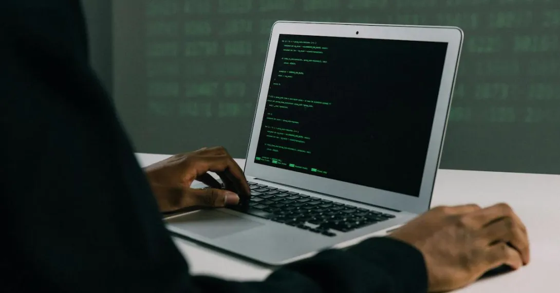 A hacker using a laptop