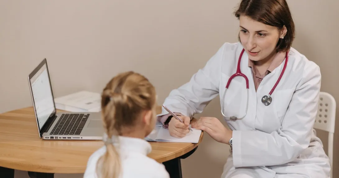 A child consulting with a doctor
