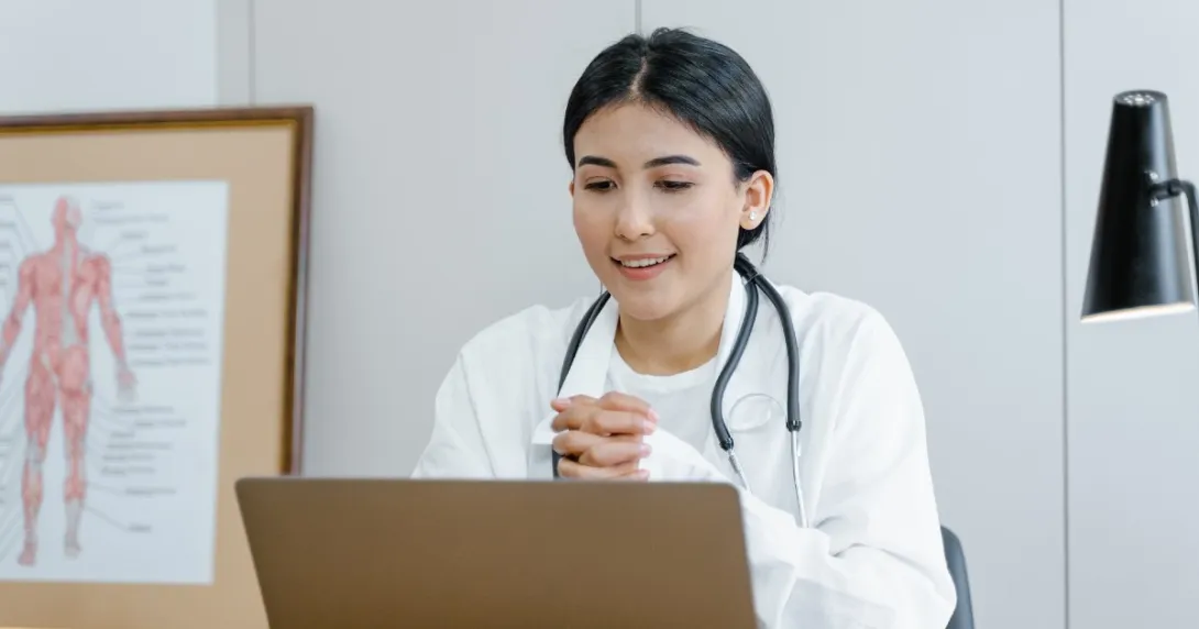 Female doctor at laptop