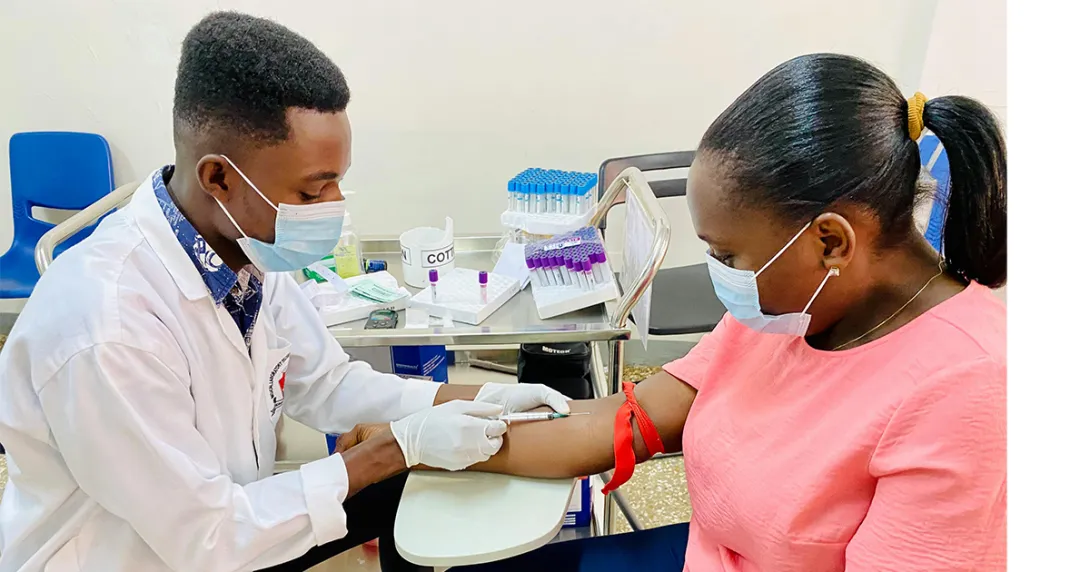 Urgent care clinician draws patient blood