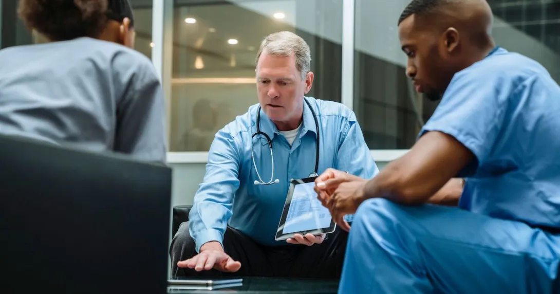 Hospital staff in discussion among themselves