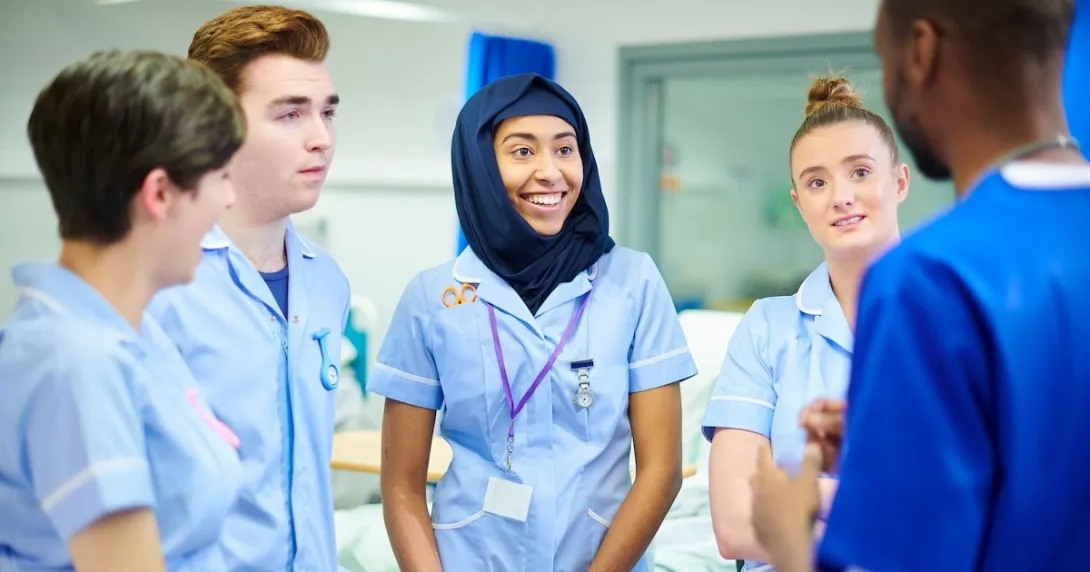 Medical students discussing with their manager