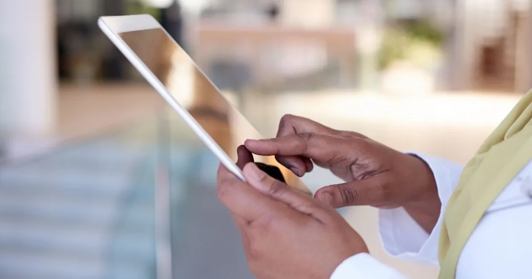 Person using a healthcare digital therapeutic app on a tablet