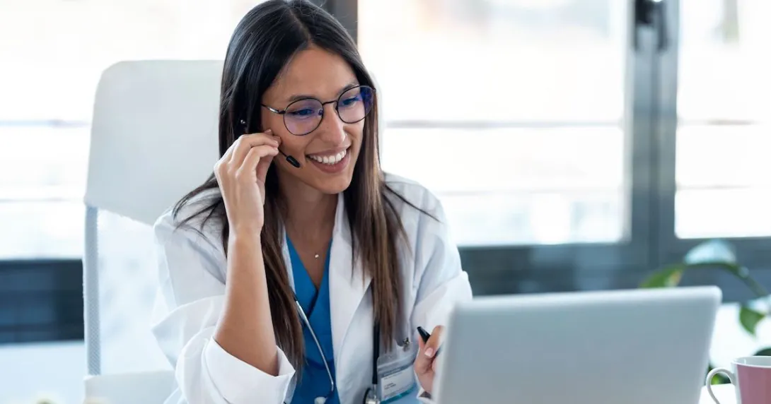 A doctor in a virtual consultation using a laptop computer